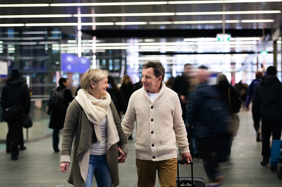 a couple walking through the train station