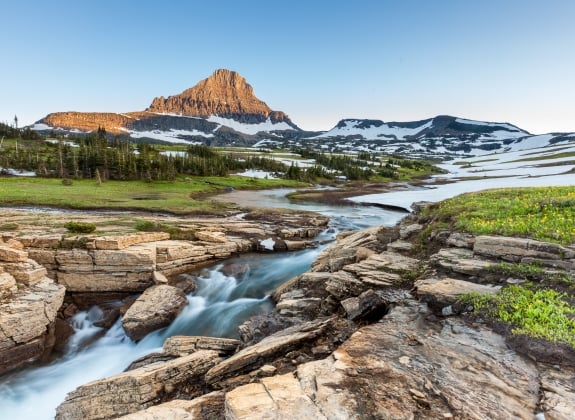 river running over rocks at Glacier National Park