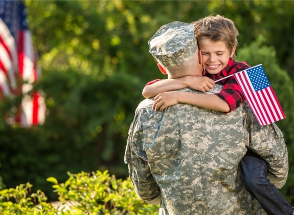 soldier hugging his son