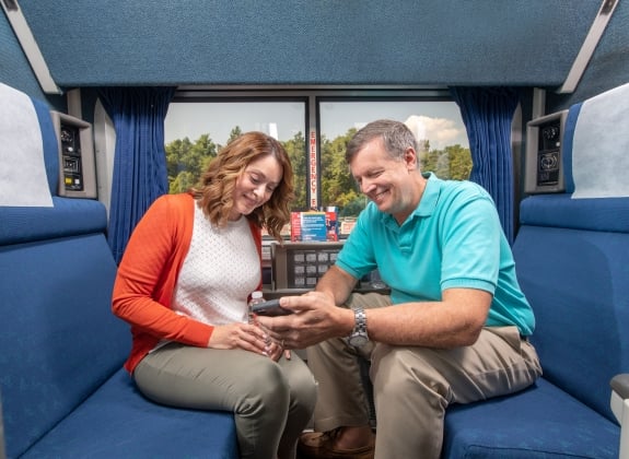 a couple onboard amtrak in a private room