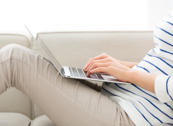 person typing on laptop keyboard