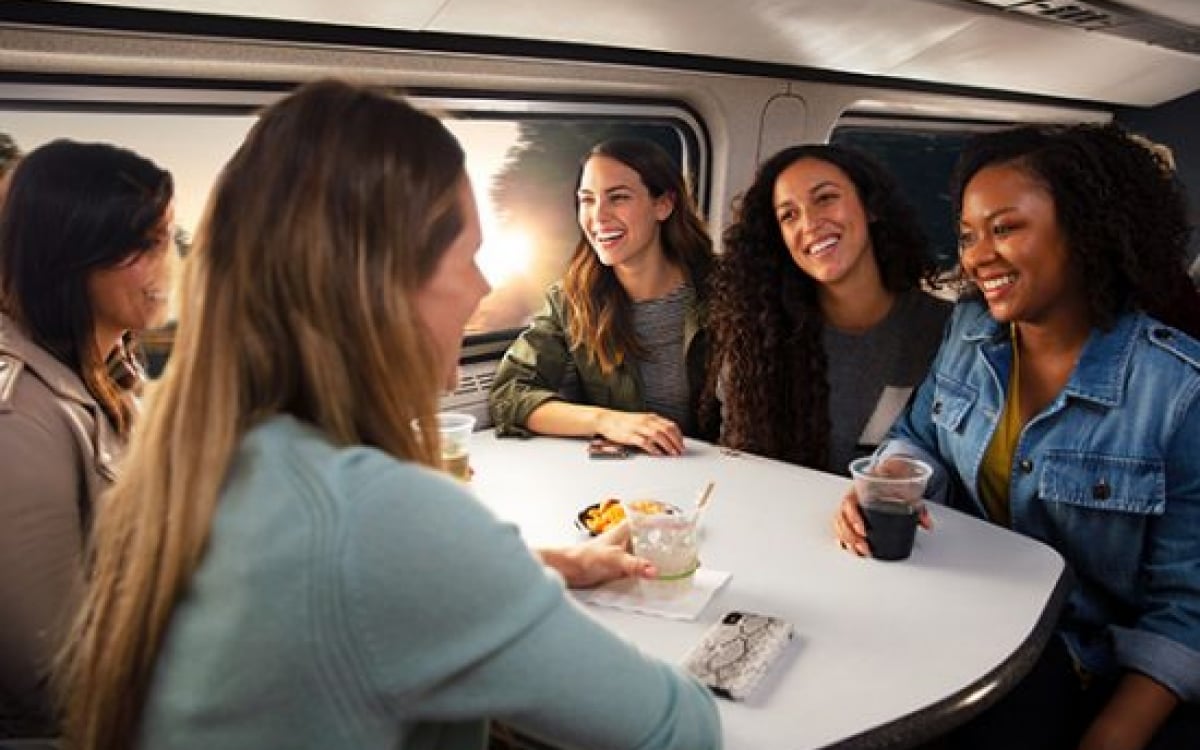 women talking in the cafe car onboard Amtrak