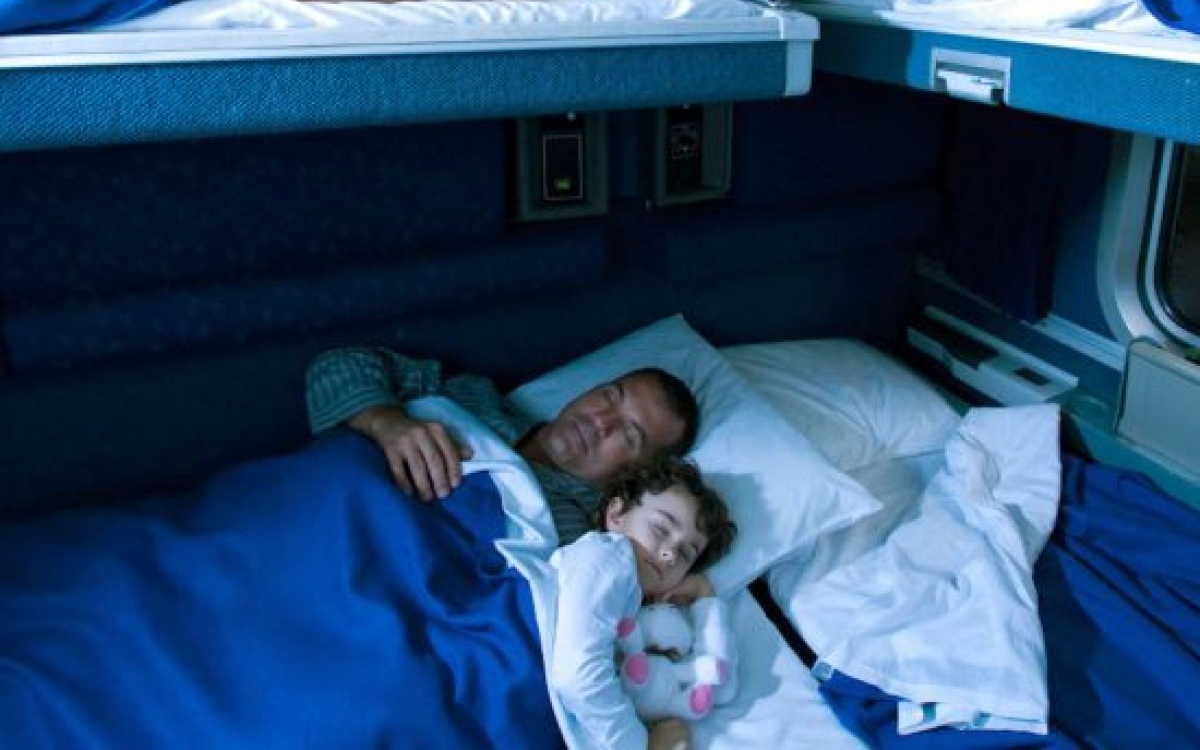 family sleeping in amtrak's family bedroom onboard train