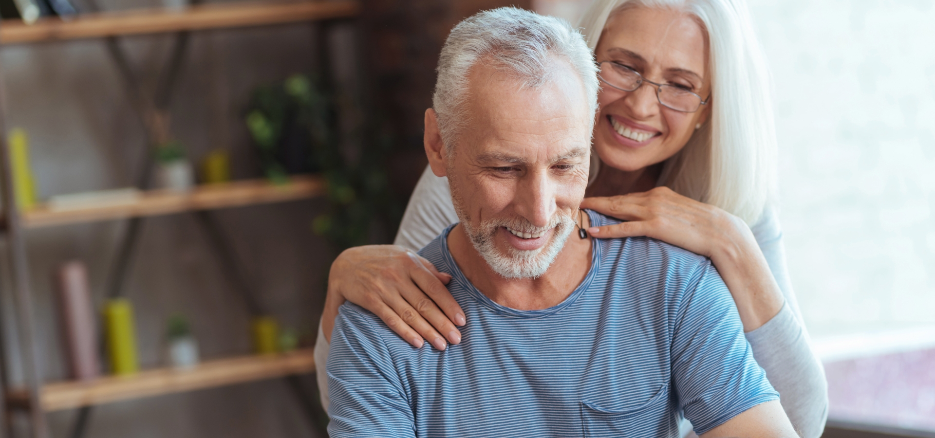 happy couple looking at laptop screen