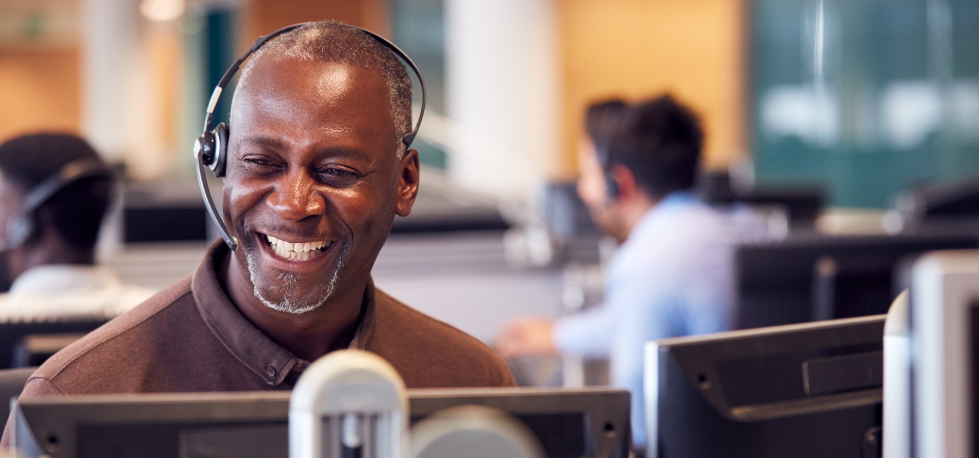 friendly man in guest relations laughing with a customer