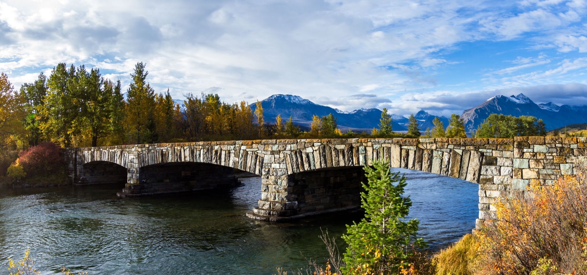 stone bridge at entrance of Glacier National Park in Montana